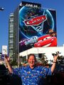 John Lasseter in front of a building advertisement in Los Angeles.
