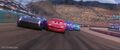 Jackson Storm passing Lightning Mcqueen,Bobby Swift and Cal Weathers