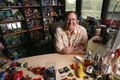 John Lasseter with a variety of Pixar merchandise