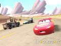 Lightning McQueen racing with Mater, Sarge and Flo.